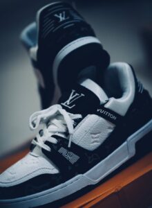 Close-up of luxury designer sneakers in a studio setting.