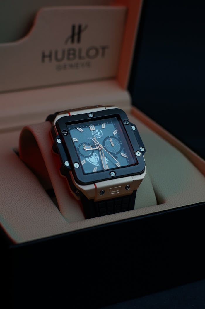 Elegant luxury Hublot watch in an exquisite display box, showcasing timeless precision.