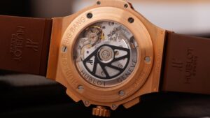 Elegant Hublot Big Bang gold watch showcasing intricate mechanical details up close.
